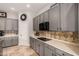 Well-designed kitchen with stainless steel microwave and stone backsplash at 2939 E Huber St, Mesa, AZ 85213