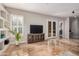 Well-lit living room with built-in shelves, a console, and a large window at 2939 E Huber St, Mesa, AZ 85213