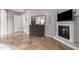 Bedroom area featuring fireplace, dresser, and flat screen television at 2939 E Huber St, Mesa, AZ 85213