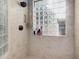 Shower features a rainfall shower head and a glass block window at 2939 E Huber St, Mesa, AZ 85213