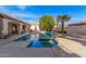 Backyard view featuring a sparkling swimming pool with a relaxing spa and mature trees at 2939 E Huber St, Mesa, AZ 85213