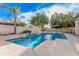 Inviting swimming pool with water features, surrounded by lush greenery, ideal for summer relaxation at 2939 E Huber St, Mesa, AZ 85213