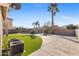 Large backyard with a pool, artificial turf, and AC units at 2942 S Sierra Hts, Mesa, AZ 85212