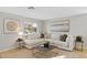 Relaxing living room featuring sectional sofa, stylish decor, and natural light at 2942 S Sierra Hts, Mesa, AZ 85212