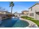 Inviting kidney shaped pool with a waterfall feature at 2942 S Sierra Hts, Mesa, AZ 85212