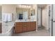 Bathroom boasts double sinks, tiled floor and bathtub at 29590 N Balmoral Pl, San Tan Valley, AZ 85143