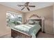 Bright bedroom with a ceiling fan and window views at 29590 N Balmoral Pl, San Tan Valley, AZ 85143