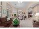 Bright dining area with a table, chairs and view into the kitchen at 29590 N Balmoral Pl, San Tan Valley, AZ 85143