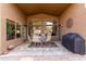 Covered patio with seating area and built-in grill at 29590 N Balmoral Pl, San Tan Valley, AZ 85143