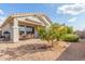 Home with covered patio, fruit tree, and gravel yard at 30130 N Jillian Dr, San Tan Valley, AZ 85143