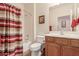 Clean bathroom with a shower/tub combo and wood vanity at 30130 N Jillian Dr, San Tan Valley, AZ 85143