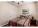 Charming bedroom with a full-size bed and double door closet at 30130 N Jillian Dr, San Tan Valley, AZ 85143