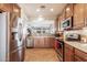 Modern kitchen featuring stainless steel appliances and ample wood cabinetry at 30130 N Jillian Dr, San Tan Valley, AZ 85143