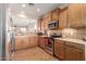 Well-equipped kitchen with wood cabinets and stainless steel appliances at 30130 N Jillian Dr, San Tan Valley, AZ 85143