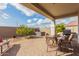 Covered patio with seating area, grill, and hot tub at 30130 N Jillian Dr, San Tan Valley, AZ 85143