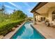 Long, refreshing pool with ample patio space for relaxing at 3047 E Marshall Ave, Phoenix, AZ 85016