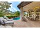 Inviting pool area with patio furniture and lush landscaping at 3047 E Marshall Ave, Phoenix, AZ 85016