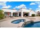 Stunning backyard with pool, spa, and outdoor kitchen at 3447 E Kenwood St, Mesa, AZ 85213