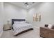 Spacious bedroom with plush bed and seating area at 3447 E Kenwood St, Mesa, AZ 85213