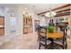 Bright breakfast area with wood table and chairs, adjacent to kitchen at 3447 E Kenwood St, Mesa, AZ 85213