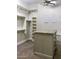 Large walk-in closet with ample shelving and built-in island at 3447 E Kenwood St, Mesa, AZ 85213