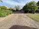 Long paved driveway leading to a private gated estate at 3447 E Kenwood St, Mesa, AZ 85213