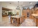 Gourmet kitchen boasts granite counters, stainless steel appliances, and an island at 3447 E Kenwood St, Mesa, AZ 85213