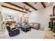 Relaxing living room with leather sofas, a coffee table, and a fireplace at 3447 E Kenwood St, Mesa, AZ 85213