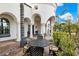 Inviting patio with a wrought iron table and chairs, perfect for outdoor dining at 3447 E Kenwood St, Mesa, AZ 85213