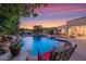 Scenic pool and spa at sunset, waterfall feature at 3447 E Kenwood St, Mesa, AZ 85213