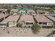 Aerial view of homes near a lake and golf course at 36168 N Stoneware Dr, Queen Creek, AZ 85140