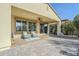 Covered patio with seating area, ceiling fan, and view of backyard at 36168 N Stoneware Dr, Queen Creek, AZ 85140