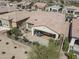 Aerial view of home with covered patio and fenced backyard at 36168 N Stoneware Dr, Queen Creek, AZ 85140