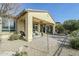 Landscaped backyard with patio, seating area, and gravel at 36168 N Stoneware Dr, Queen Creek, AZ 85140