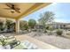 Covered patio with paver stones and a relaxing sitting area at 36168 N Stoneware Dr, Queen Creek, AZ 85140