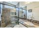 Bathroom with a walk-in shower and granite vanity at 36168 N Stoneware Dr, Queen Creek, AZ 85140