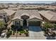 Single-story home with two-car garage and landscaping at 36168 N Stoneware Dr, Queen Creek, AZ 85140