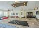 Modern kitchen with a large island and a sleek cooktop at 36168 N Stoneware Dr, Queen Creek, AZ 85140