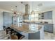 Modern kitchen featuring a large island and ample cabinet space at 36168 N Stoneware Dr, Queen Creek, AZ 85140