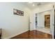 Bright home office with hardwood floors and built-in shelving at 36168 N Stoneware Dr, Queen Creek, AZ 85140