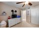 Bedroom with dresser, TV, fish tank, and Mickey Mouse decor at 3639 E San Pedro Ave, Gilbert, AZ 85234