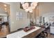 Open concept dining room with a rustic table and access to the kitchen at 3639 E San Pedro Ave, Gilbert, AZ 85234