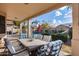 Covered patio with seating area overlooking pool and backyard at 3639 E San Pedro Ave, Gilbert, AZ 85234