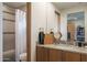 Modern bathroom with granite countertop, shower, and a toilet at 38484 N 94Th St, Scottsdale, AZ 85262