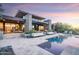 Modern home with pool and landscaped backyard; expansive patio and stunning sunset views at 38484 N 94Th St, Scottsdale, AZ 85262