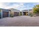 Two-car garage with wood doors and paved driveway at 38484 N 94Th St, Scottsdale, AZ 85262