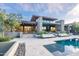 Contemporary home exterior with a large pool and patio at 38484 N 94Th St, Scottsdale, AZ 85262