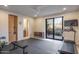 Home gym with treadmill, weights, and access to a private patio at 38484 N 94Th St, Scottsdale, AZ 85262