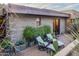 Private patio with seating area, brick flooring, and lush landscaping at 38484 N 94Th St, Scottsdale, AZ 85262