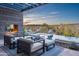 Relaxing patio seating area with fire pit and stunning desert landscape views at 38484 N 94Th St, Scottsdale, AZ 85262